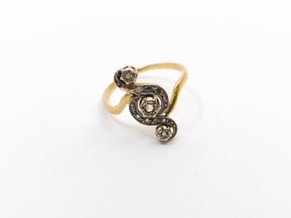 BAGUE TOURBILLON en or deux tons ornée de...