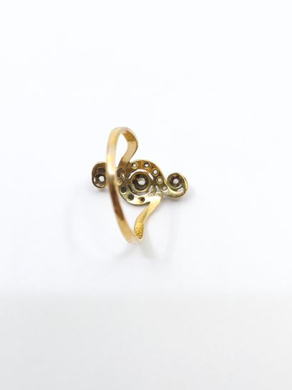 BAGUE TOURBILLON en or deux tons ornée de...