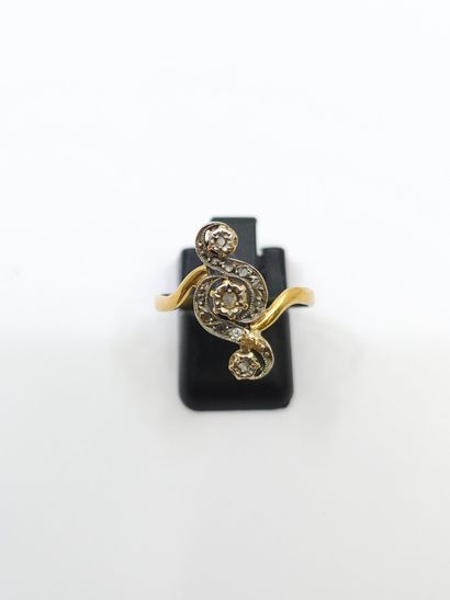 BAGUE TOURBILLON en or deux tons ornée de...
