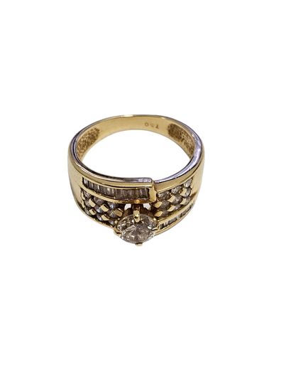 BAGUE en or jaune 750° ornée d'un diamant...