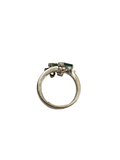 750 white gold ring set with a floral motif...
