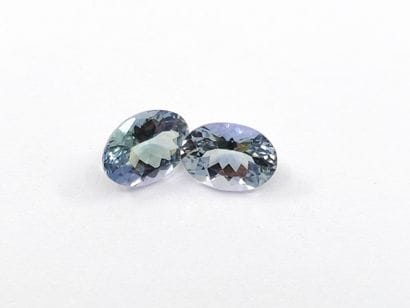 TWO greenish IF TANZANITES in oval form,...