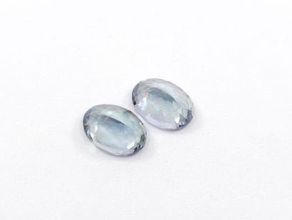 TWO greenish IF TANZANITES in oval form,...