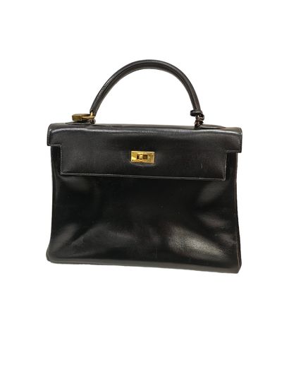 HERMES KELLY
Smooth black leather bag, gold...