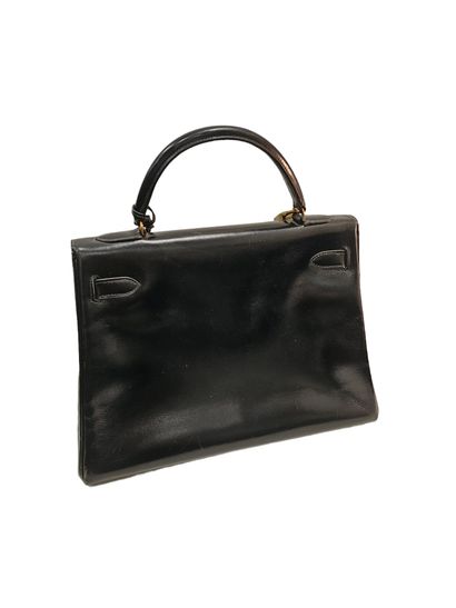HERMES KELLY
Smooth black leather bag, gold...