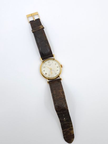 LIP 
Wristwatch, round case in 750° yellow...