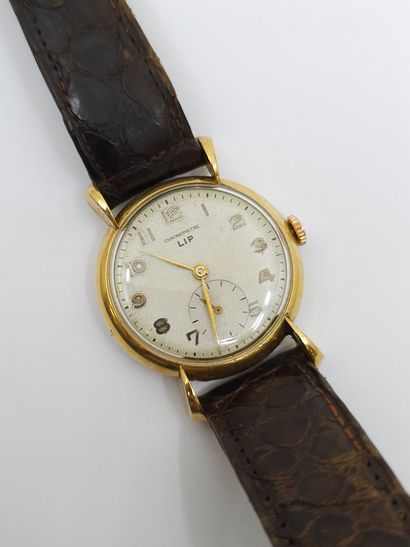 LIP 
Wristwatch, round case in 750° yellow...