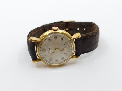 LIP 
Wristwatch, round case in 750° yellow...