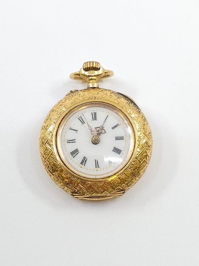 MONTRE de col en or jaune 750° finement ciselée...