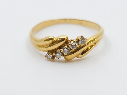 RING in 750° yellow gold set with five diamonds
Gross...
