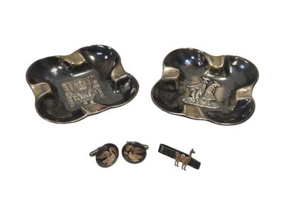 PERUVIAN WORK
Two silver ashtrays, one decorated...
