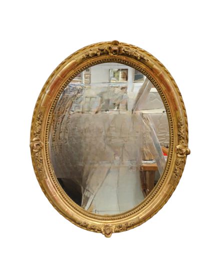 Louis XV style oval wood and gilded stucco...