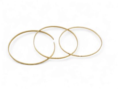 TROIS BRACELETS en or jaune 750°
Poids total...