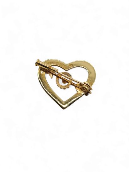 Heart brooch pierced with an arrow in 750°...