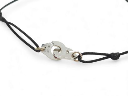 DINH VAN 
Bracelet menottes en or gris 750°...