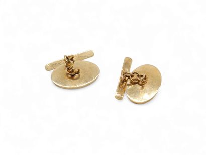 PAIRE de boutons de manchettes en or jaune...