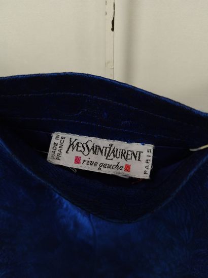 YVES SAINT LAURENT
Blue three-piece suit
Dress,...