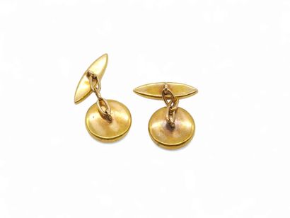 PAIRE de boutons de manchettes en or jaune...