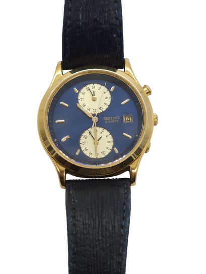 SEIKO 
Wristwatch, round gold-plated metal...