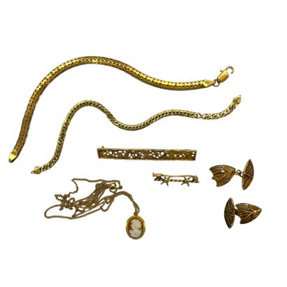 LOT d'or 750° comprenant : 
Deux broches...