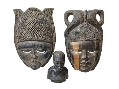 BENIN
Pair of carved wooden masks representing...