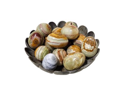 Stone eggs in a plastic bowl