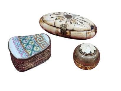 Three metal boxes and one in camel bone