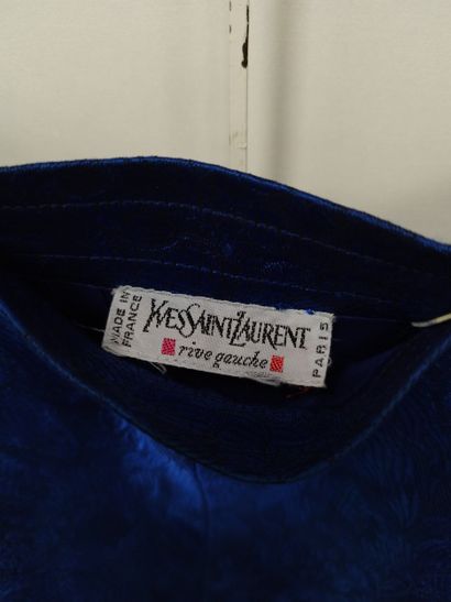 YVES SAINT LAURENT
Blue three-piece suit
Dress,...