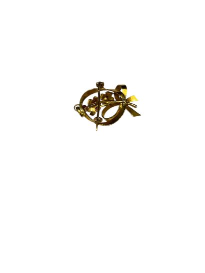 BROCHE NOEUD en or jaune 750° ornée de fleurs...