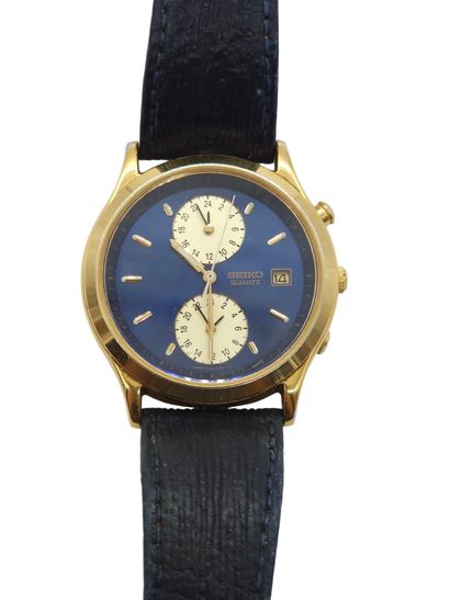 SEIKO 
Wristwatch, round gold-plated metal...