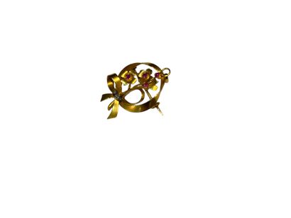 BROCHE NOEUD en or jaune 750° ornée de fleurs...