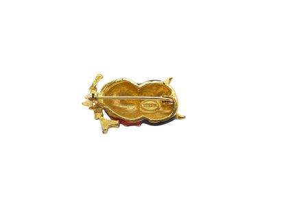 STERN 
Owl brooch in gilt metal and red and...