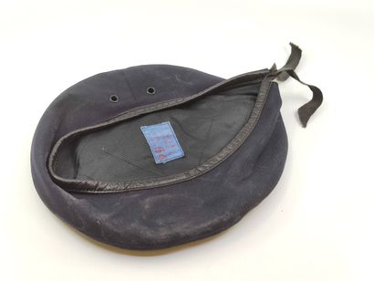 French beret. 
In black cloth. A stick is...