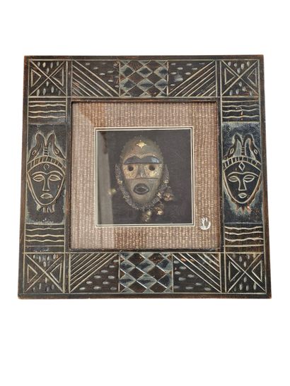 An African frame in repoussé metal