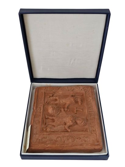 A terracotta-style plaque
A medieval sce...