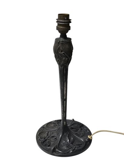 Reunion of two lamp bases in wrought iron...