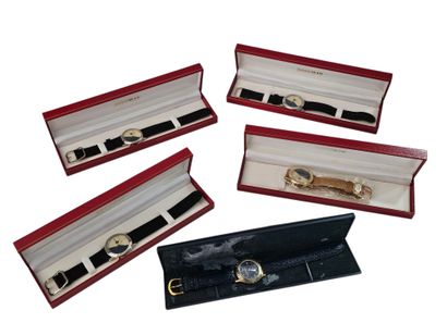 Five modern watches in their boxes