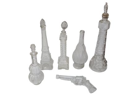Set of nine blown glass bottles depicting...