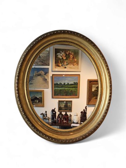 Gilded carved wood oval frame with pearl...