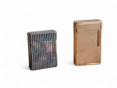 DUPONT
Two lighters in gold- and silver-plated...
