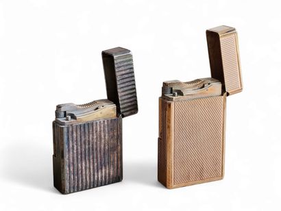 DUPONT
Two lighters in gold- and silver-plated...
