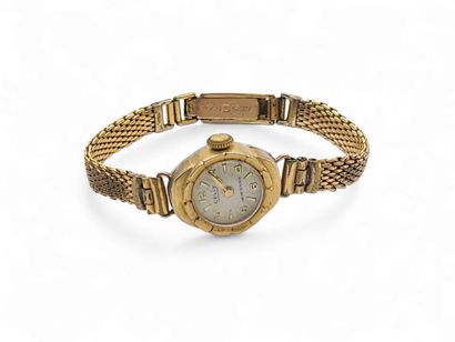 CELLY
Gilt metal wristwatch, round case,...