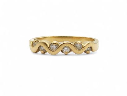 BAGUE type demi-alliance en or jaune 750°...