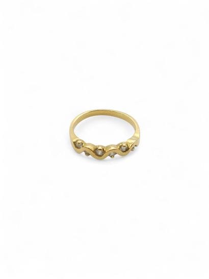 BAGUE type demi-alliance en or jaune 750°...
