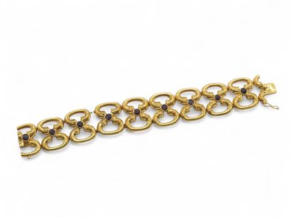 BRACELET en or jaune 750° articulé ornée...