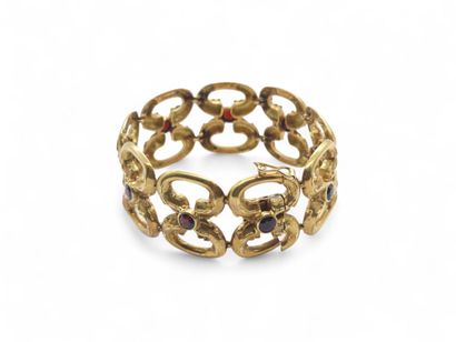 BRACELET en or jaune 750° articulé ornée...