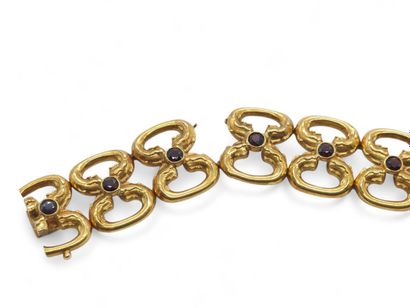 BRACELET en or jaune 750° articulé ornée...