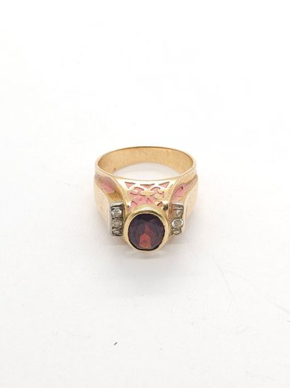RING in yellow gold 750°, set with a garnet...