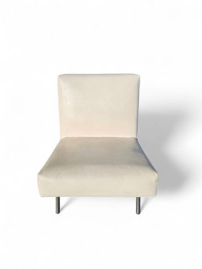 An armchair with a slightly sloping back...