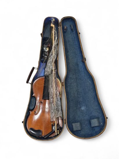 A violin in a box
As is
We enclose 
A violin...